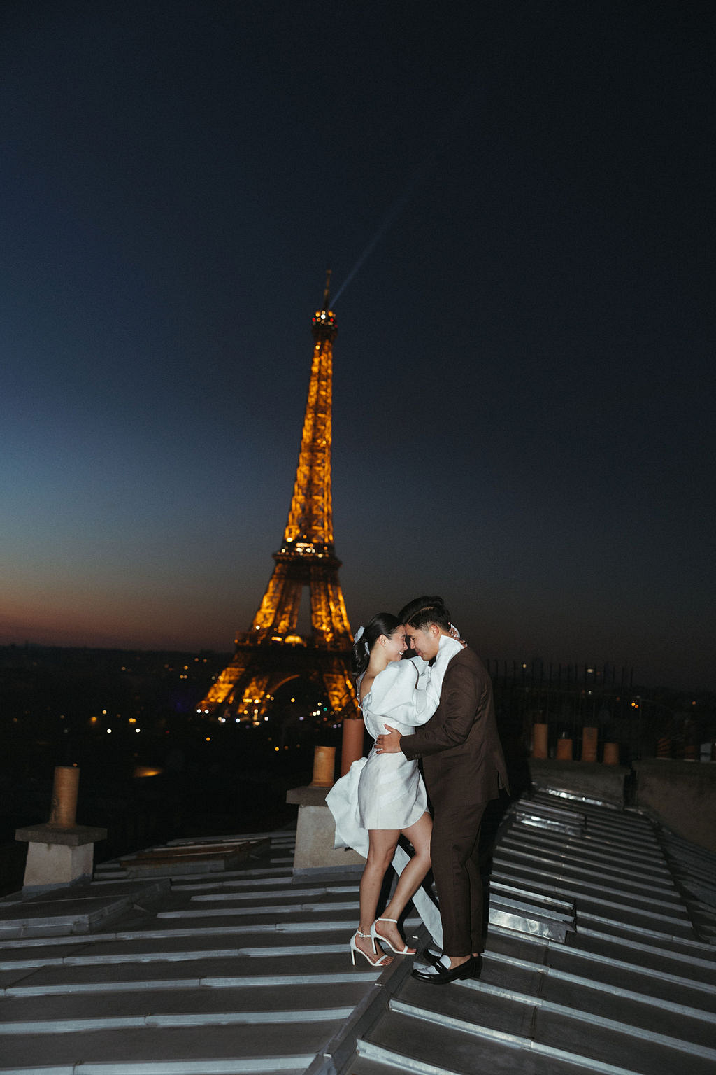Paris Pre-Wedding Photoshoot with Eiﬀel Tower Louvre Museum Parisian Cafe Vintage Car Rooftop Night at Paris Rooftop pre-wedding photo