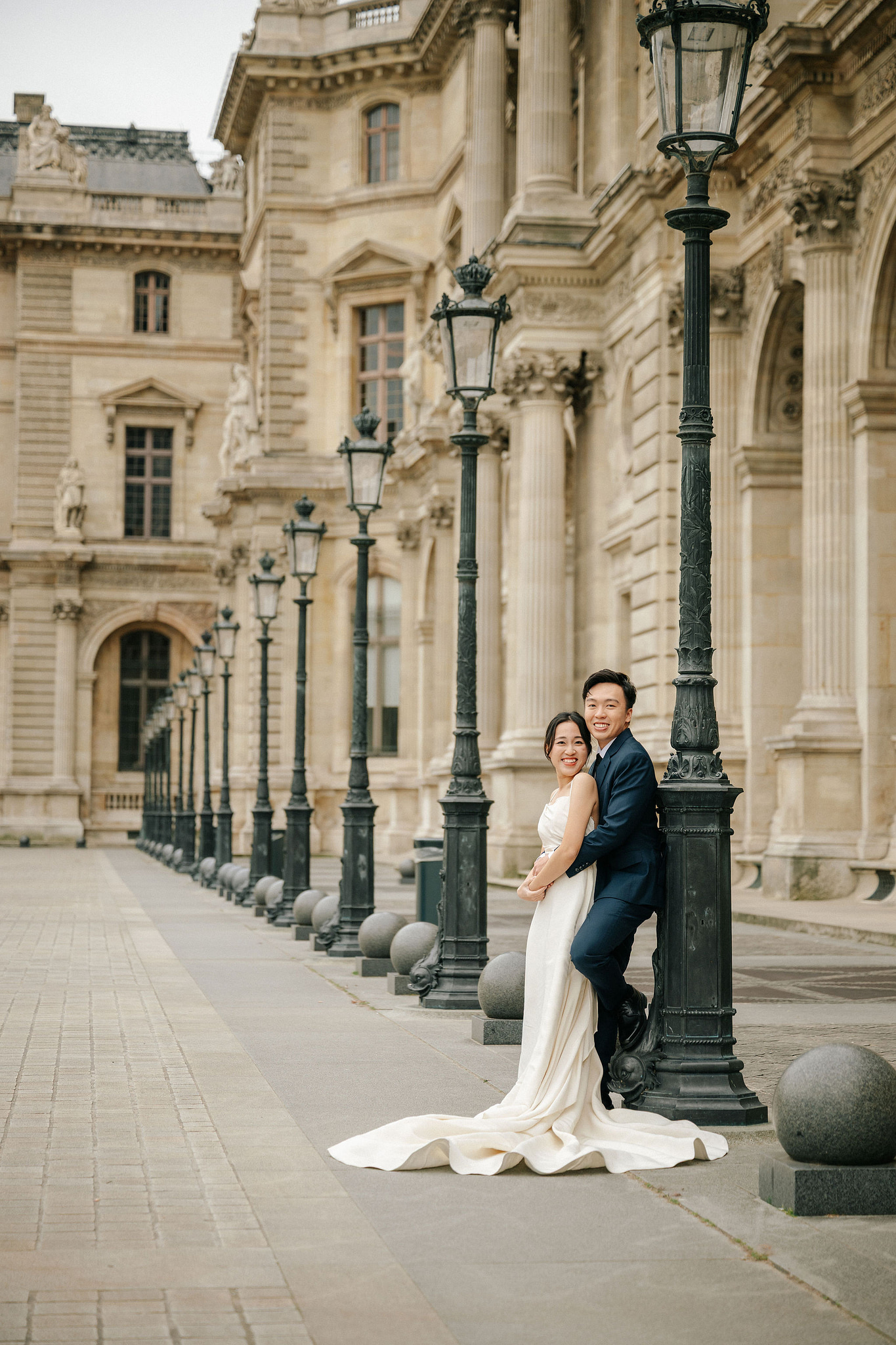 Paris Pre-Wedding Photoshoot | Place du Trocadéro, Bir-Hakeim Bridge, Louvre Pyramid, Tuileries Garden & Montmartre at Louvre Pyramid pre-wedding photo