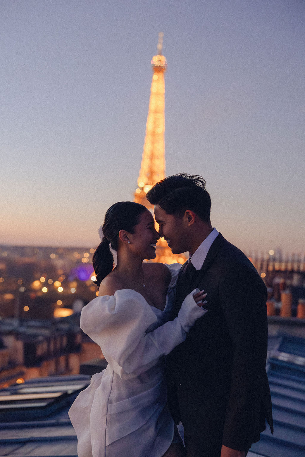 Paris Pre-Wedding Photoshoot with Eiﬀel Tower Louvre Museum Parisian Cafe Vintage Car Rooftop Night at Paris Rooftop pre-wedding photo