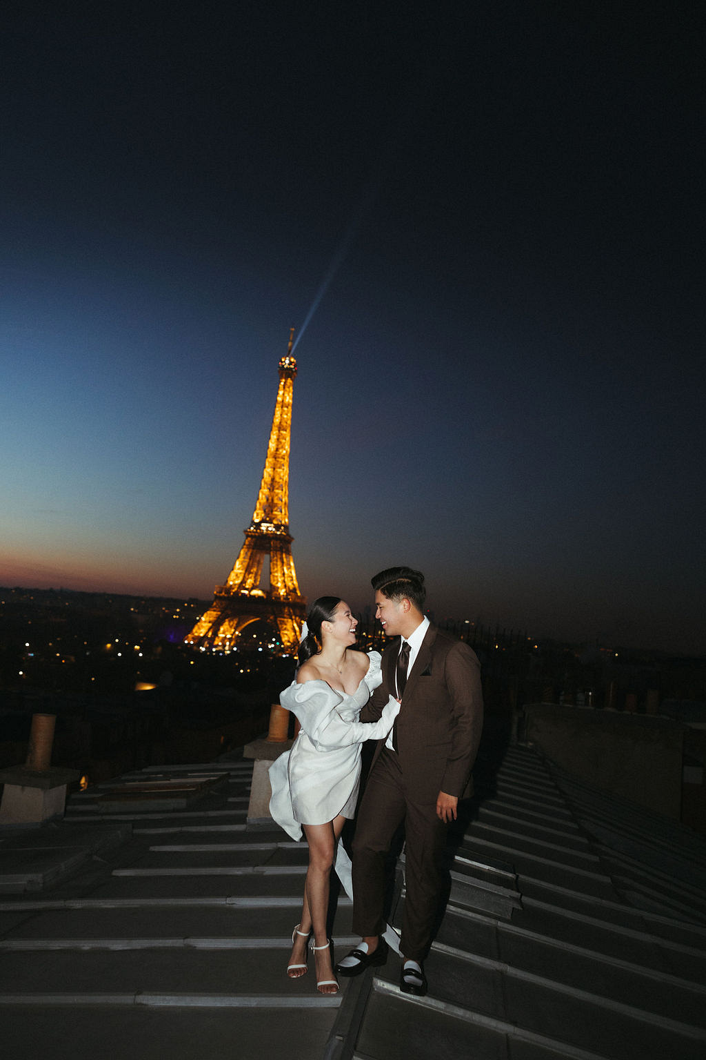 Paris Pre-Wedding Photoshoot with Eiﬀel Tower Louvre Museum Parisian Cafe Vintage Car Rooftop Night at Paris Rooftop pre-wedding photo