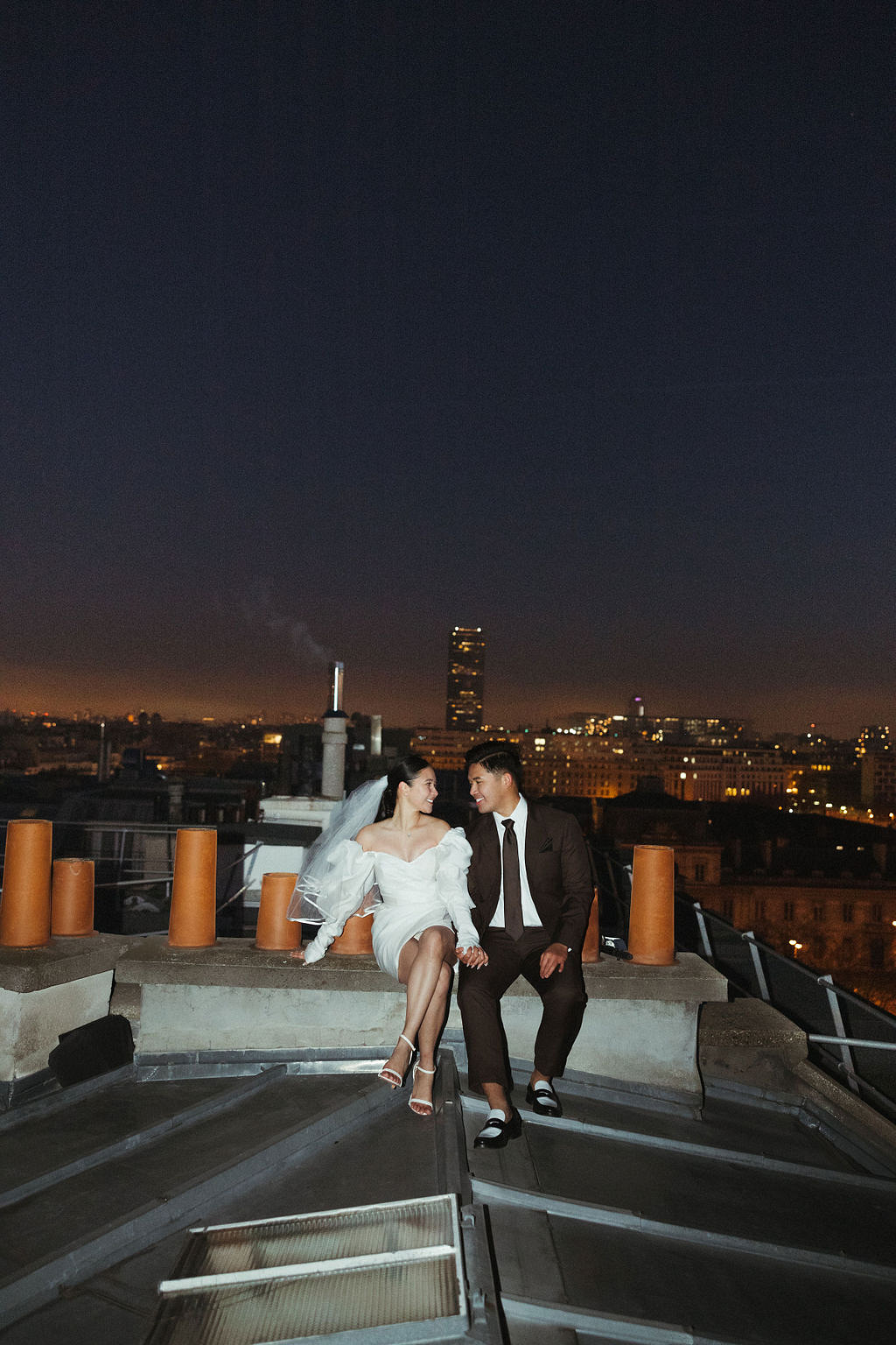 Paris Pre-Wedding Photoshoot with Eiﬀel Tower Louvre Museum Parisian Cafe Vintage Car Rooftop Night at Paris Rooftop pre-wedding photo