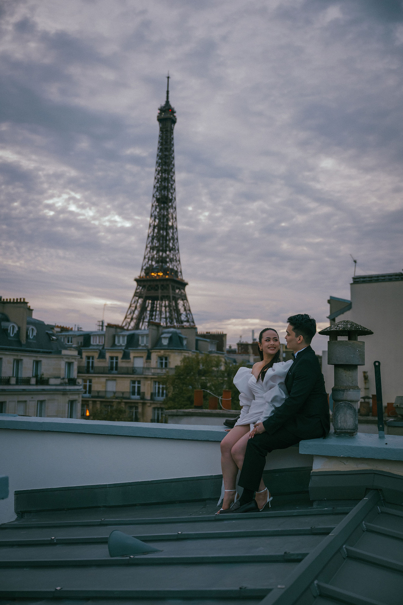 Paris Pre-Wedding Photoshoot | Trocadéro, Vintage Car, Parisian Café, Paris Rooftop & Louvre at Paris Rooftop pre-wedding photo