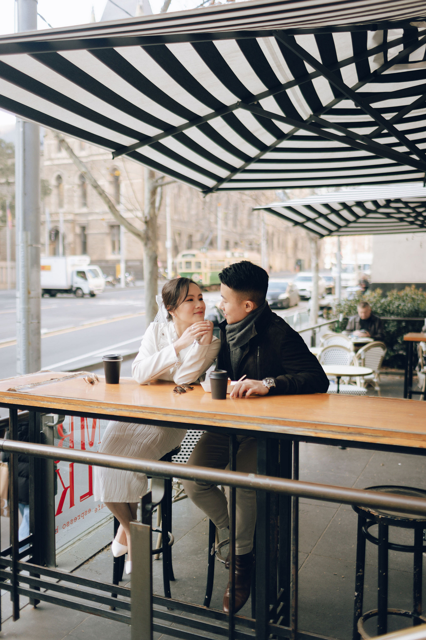 Melbourne Pre-Wedding Photoshoot | Cafe, Redwood Forest, City Streets & Carlton Gardens at City Cafe pre-wedding photo