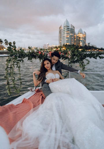 Sunset Prewedding Photoshoot On A Yacht With Romantic Floral Styling