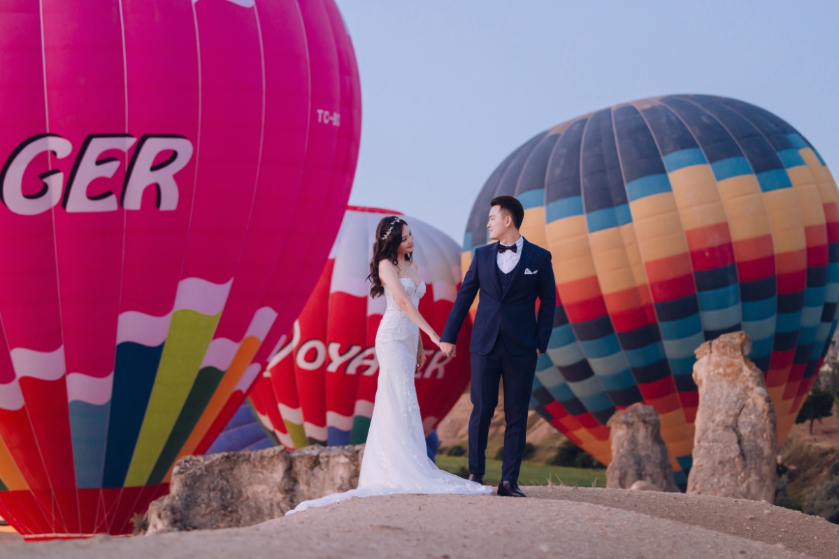 Cappadocia Pre-Wedding Photoshoot Hot Air Balloons Red Convertible Cave Hotel Roof Turkish Fairy Lamps Salt Lake by Aric on OneThreeOneFour 6