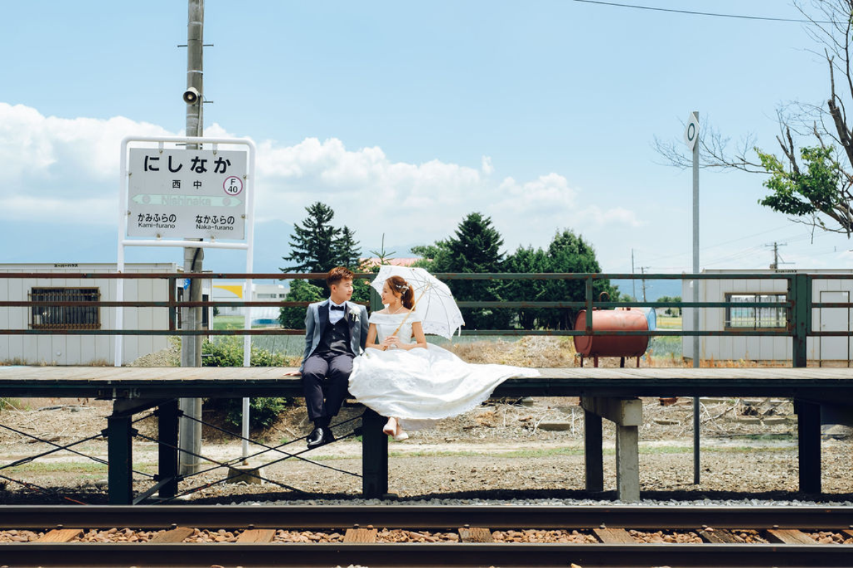 Hokkaido Prewedding Photoshoot At Anime Railway Track, Hinode Park, Shikisai No Oka During Summer's Floral Season by Kuma on OneThreeOneFour 0