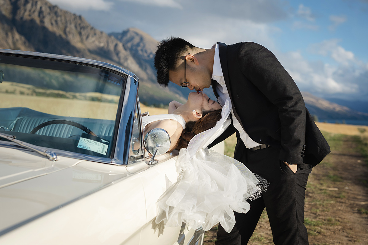Enchanting Pre-Wedding Photoshoot in Queenstown, New Zealand: Vintage Car, White Horse, and Helicopter amidst Snow-Capped Mountains by Fei on OneThreeOneFour 7
