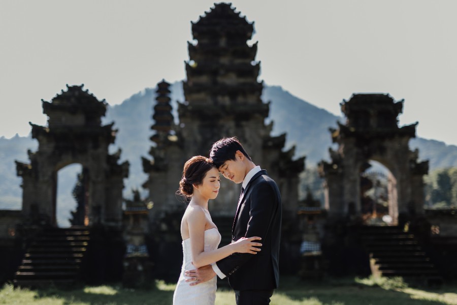 C&K: Hong Kong Couple's pre-wedding photoshoot in Bali at Lake Tamblingan, waterfall, Bali swings and beach by Hendra on OneThreeOneFour 16