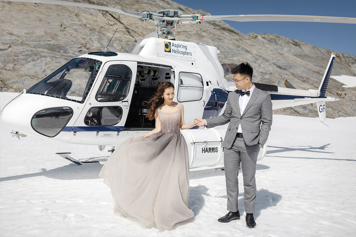 Enchanting Pre-Wedding Photoshoot in Queenstown, New Zealand: Vintage Car, White Horse, and Helicopter amidst Snow-Capped Mountains by Fei on OneThreeOneFour 11