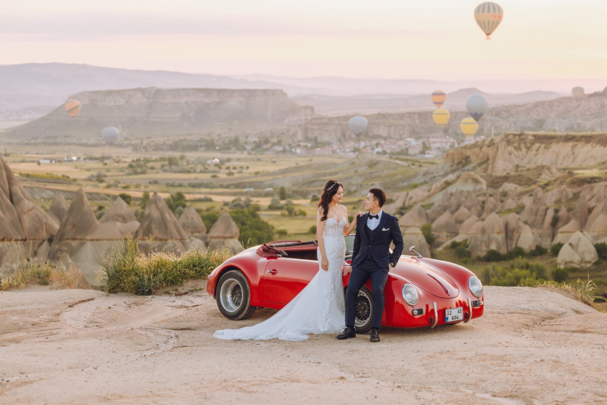 Cappadocia Pre-Wedding Photoshoot Hot Air Balloons Red Convertible Cave Hotel Roof Turkish Fairy Lamps Salt Lake by Aric on OneThreeOneFour 4