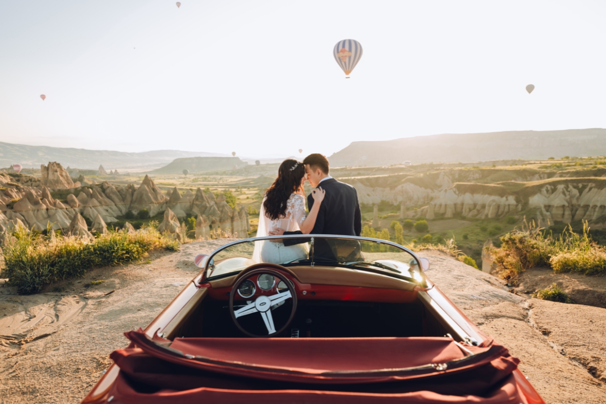 Cappadocia Pre-Wedding Photoshoot Hot Air Balloons Red Convertible Cave Hotel Roof Turkish Fairy Lamps Salt Lake by Aric on OneThreeOneFour 2